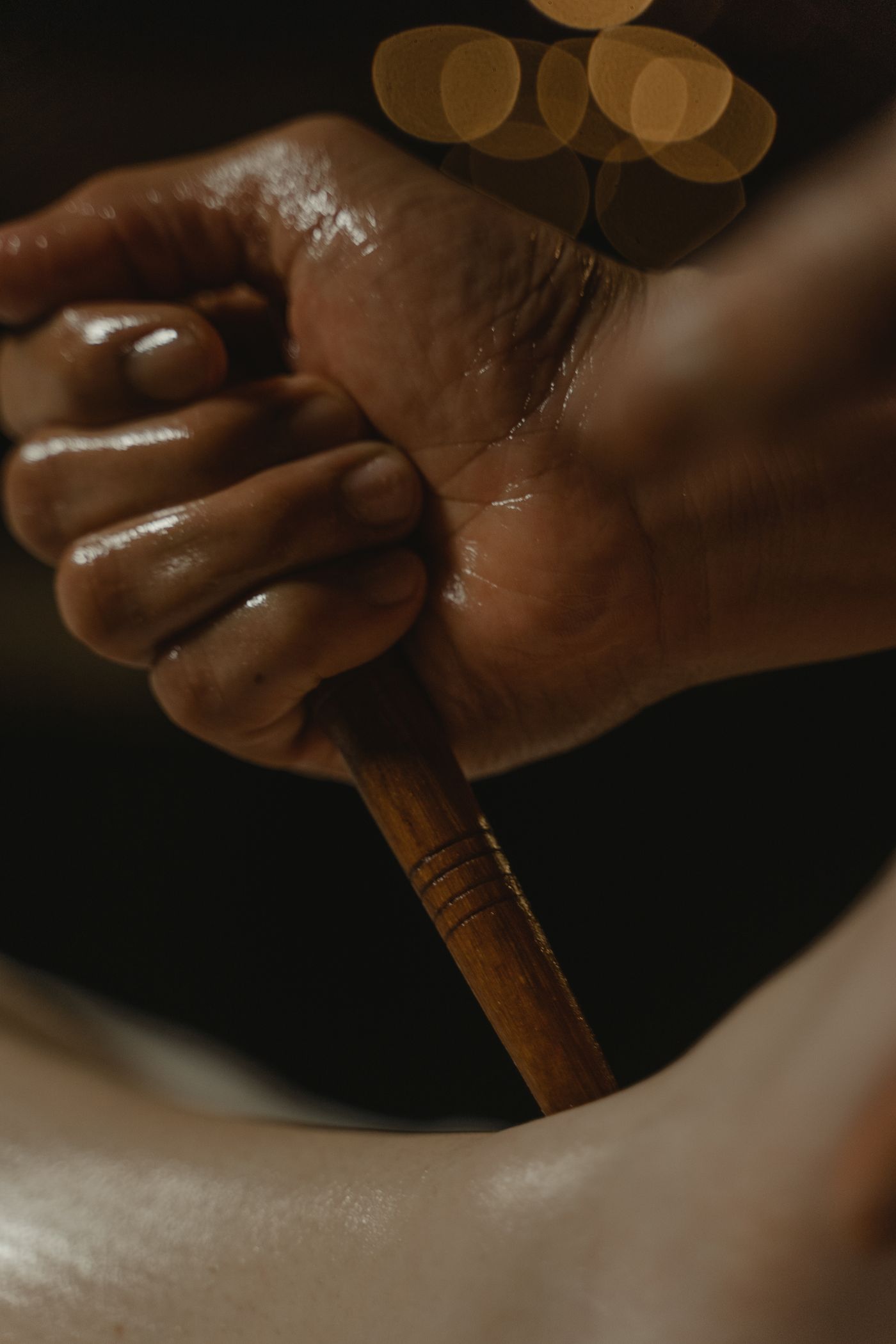 Traditional Thai massage using a wooden tool