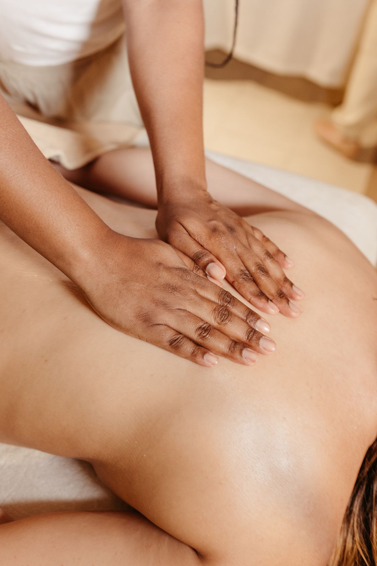 Gentle relaxation massage on a client's back