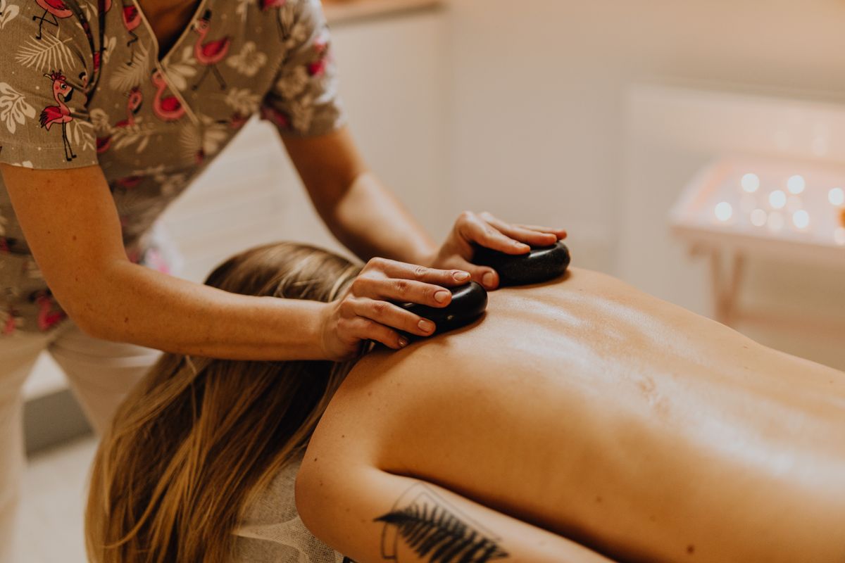 Hot stones placed along a client's back during treatment