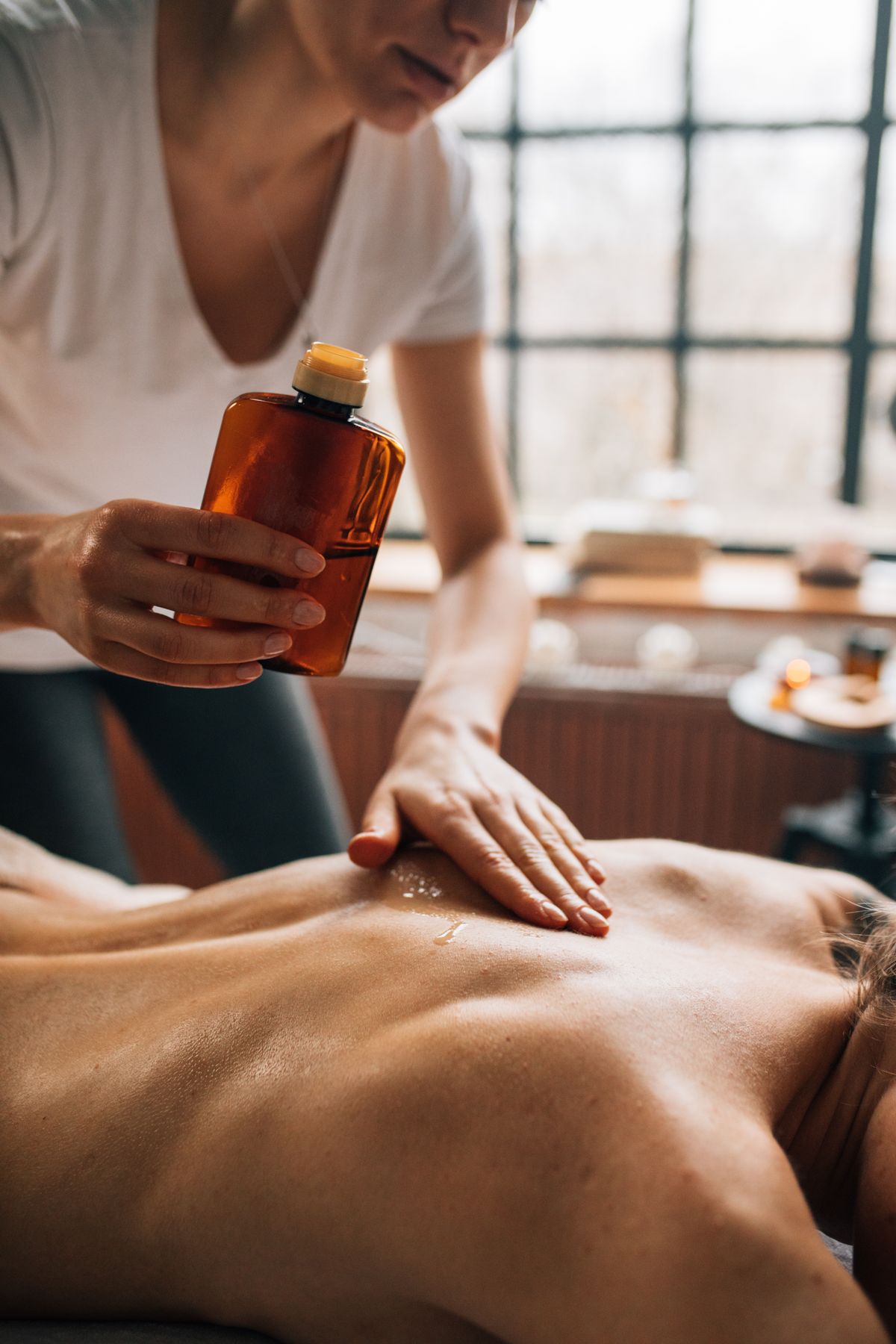 Warm oil poured for a full body massage